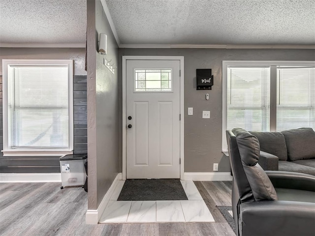 3 Antler Blvd, Mcloud, OK 74851 - entrance foyer with a textured ceiling, crown molding, wood finished floors, and baseboards