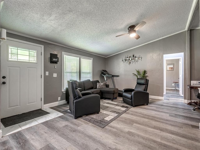 3 Antler Blvd, Mcloud, OK 74851 - living room with wood finished floors, a ceiling fan, a textured ceiling, ornamental molding, and baseboards