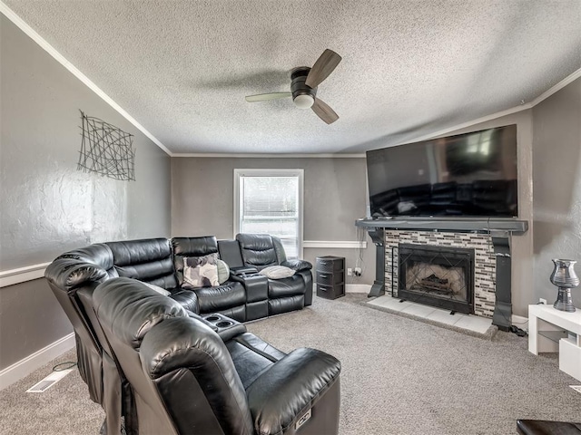 3 Antler Blvd, Mcloud, OK 74851 - living area with ceiling fan, carpet floors, a textured ceiling, a fireplace with raised hearth, and ornamental molding