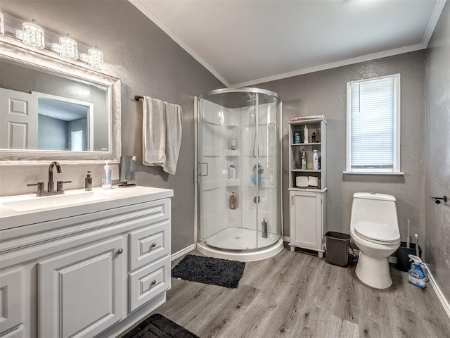 3 Antler Blvd, Mcloud, OK 74851 - bathroom featuring wood finished floors, a shower stall, toilet, vanity, and crown molding