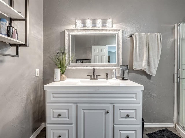 3 Antler Blvd, Mcloud, OK 74851 - bathroom featuring vanity, baseboards, a stall shower, and a textured wall