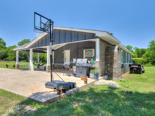 3 Antler Blvd, Mcloud, OK 74851 - back of house featuring a lawn, a patio area, and board and batten siding