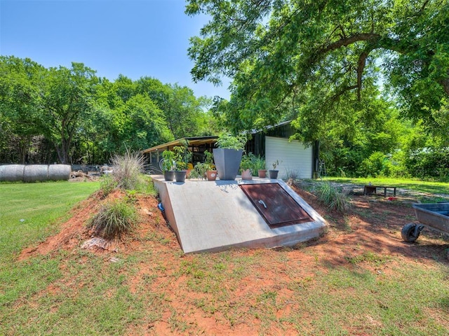 3 Antler Blvd, Mcloud, OK 74851 - view of storm shelter featuring a yard