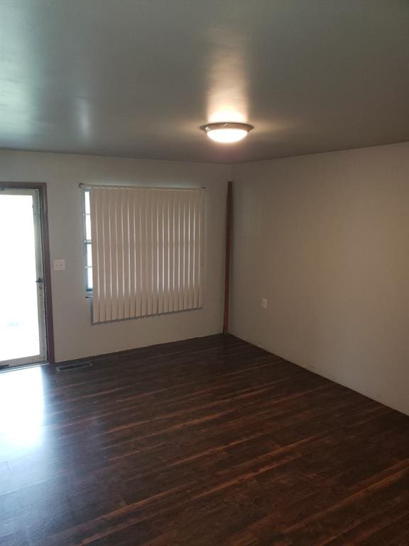 214 N Pecan St, Crescent, OK 73028 - unfurnished room with dark wood finished floors