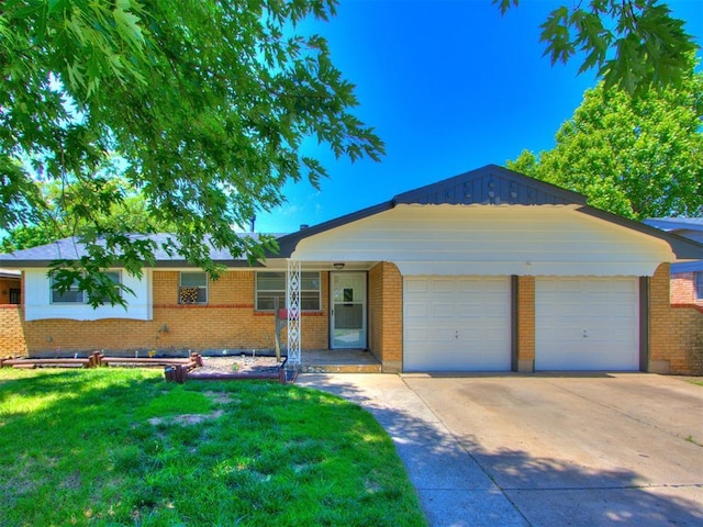 7017 S Miller Ave, Oklahoma City, OK 73159 - ranch-style home featuring an attached garage, brick siding, and driveway