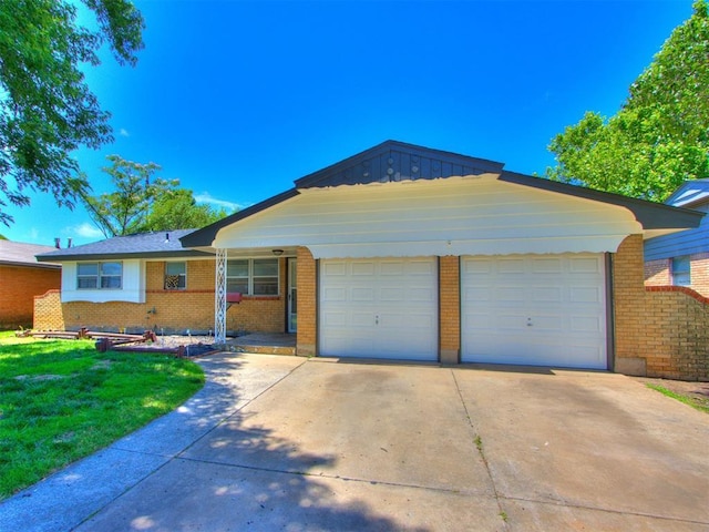 7017 S Miller Ave, Oklahoma City, OK 73159 - single story home with brick siding, driveway, an attached garage, and a front yard
