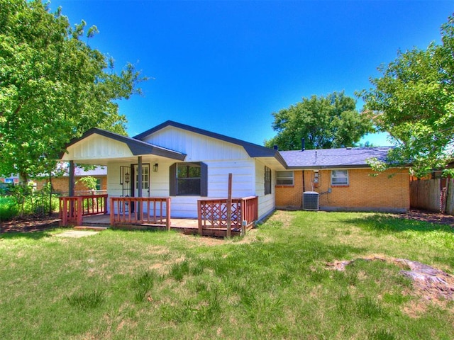7017 S Miller Ave, Oklahoma City, OK 73159 - back of house featuring a lawn and brick siding