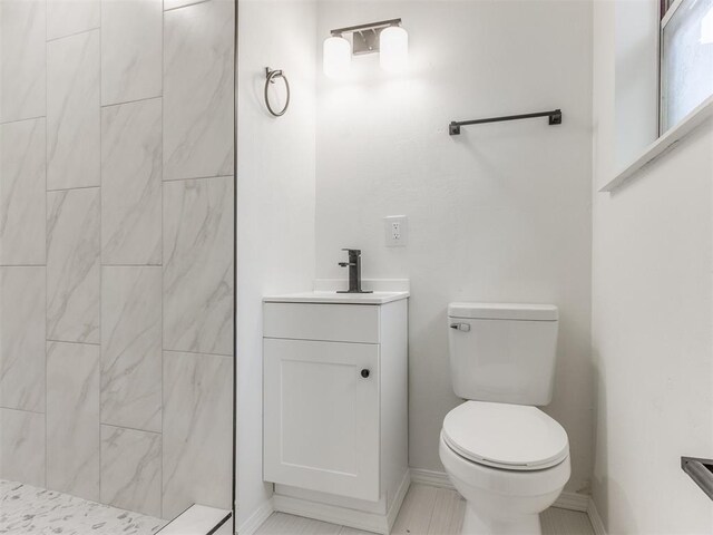 7017 S Miller Ave, Oklahoma City, OK 73159 - bathroom featuring tiled shower and vanity