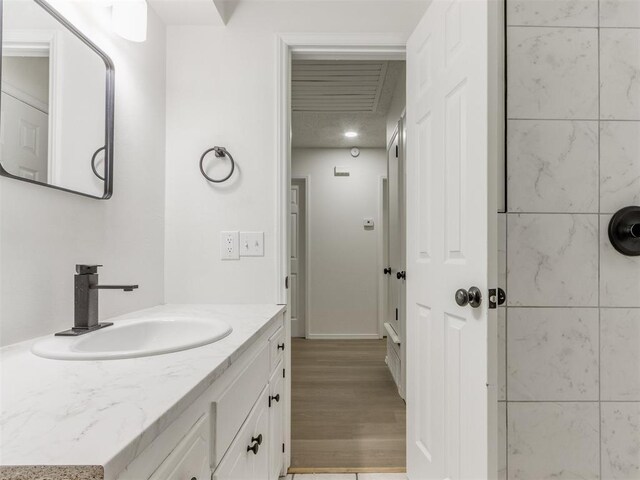 7017 S Miller Ave, Oklahoma City, OK 73159 - bathroom featuring vanity and wood finished floors