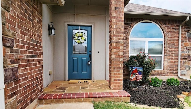 2517 NW 194th St, Edmond, OK 73012 - doorway to property with brick siding and roof with shingles