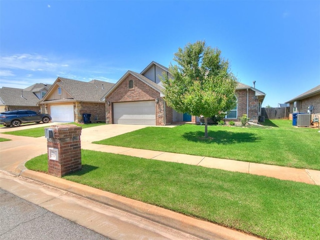 2517 NW 194th St, Edmond, OK 73012 - view of front of property featuring an attached garage, concrete driveway, and brick siding
