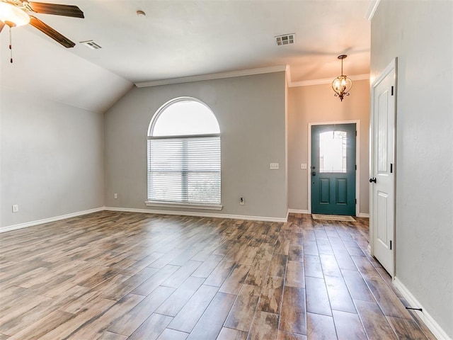 2517 NW 194th St, Edmond, OK 73012 - foyer entrance with ceiling fan, wood finished floors, crown molding, lofted ceiling, and a chandelier