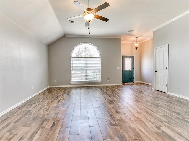2517 NW 194th St, Edmond, OK 73012 - unfurnished living room featuring healthy amount of natural light, a ceiling fan, wood finished floors, a chandelier, and ornamental molding