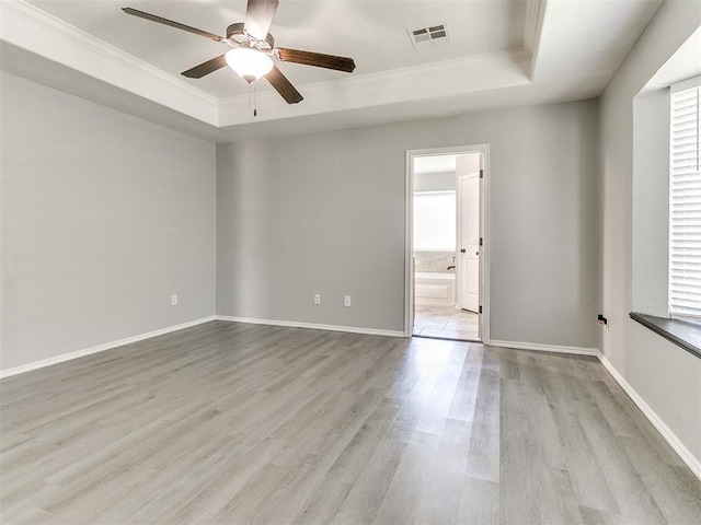 2517 NW 194th St, Edmond, OK 73012 - unfurnished room featuring a raised ceiling, crown molding, wood finished floors, and ceiling fan
