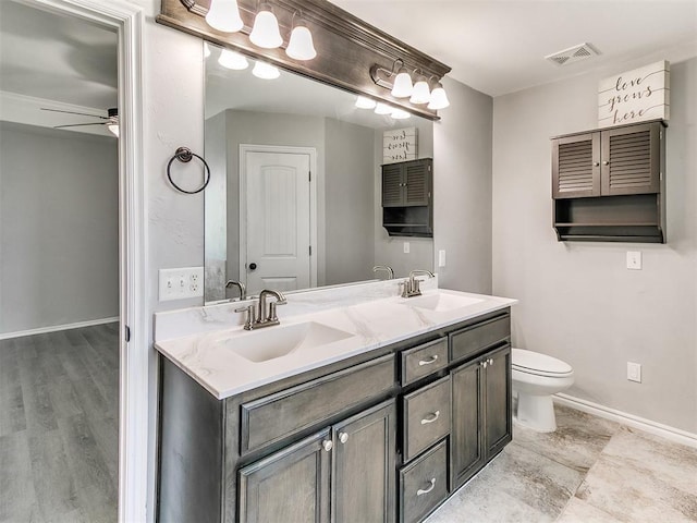2517 NW 194th St, Edmond, OK 73012 - bathroom featuring double vanity and a ceiling fan