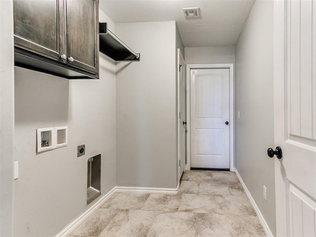 2517 NW 194th St, Edmond, OK 73012 - washroom featuring hookup for an electric dryer, cabinet space, washer hookup, and light stone finish floors