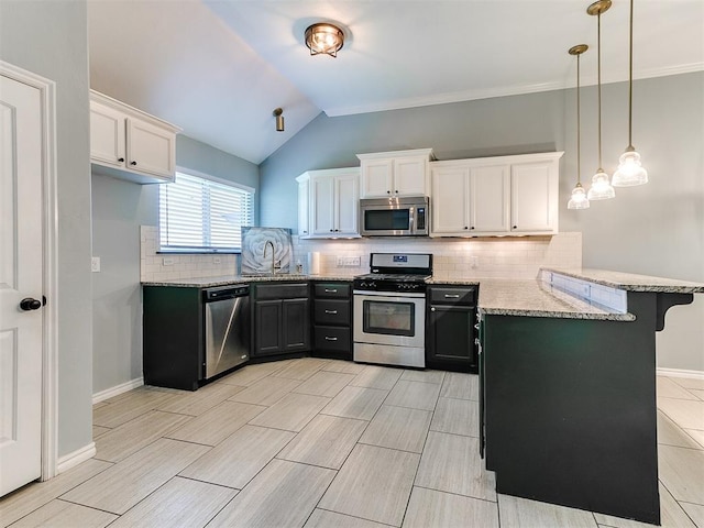 2517 NW 194th St, Edmond, OK 73012 - kitchen featuring appliances with stainless steel finishes, a peninsula, white cabinets, light stone countertops, and a breakfast bar area