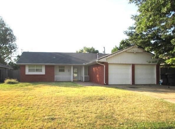 5720 Rushing Rd, Oklahoma City, OK 73132 - single story home with an attached garage, a front lawn, driveway, and brick siding