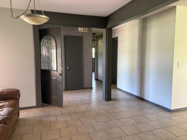 5720 Rushing Rd, Oklahoma City, OK 73132 - entryway featuring baseboards