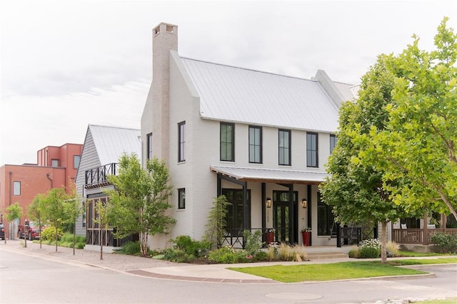 1700 Runway Blvd, Oklahoma City, OK 73108 - view of front of property with a metal roof and a chimney