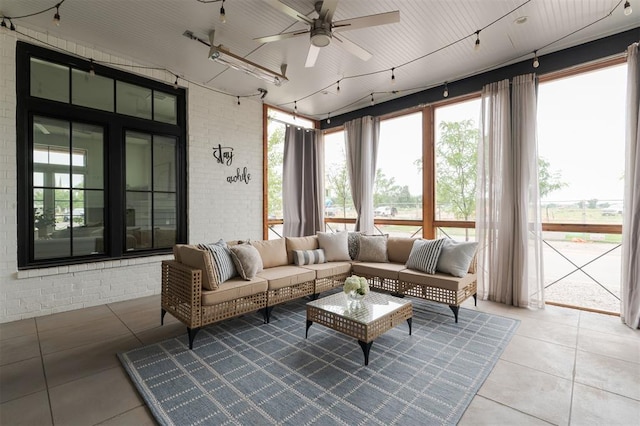 1700 Runway Blvd, Oklahoma City, OK 73108 - sunroom / solarium featuring tile patterned flooring, healthy amount of natural light, and brick wall