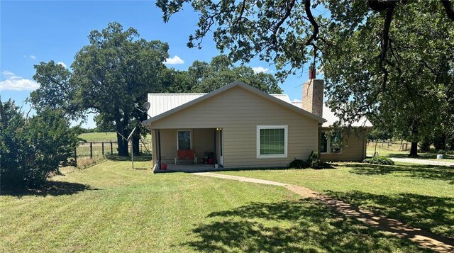 5311 S Cason Rd, Marlow, OK 73055 - view of front facade featuring a chimney