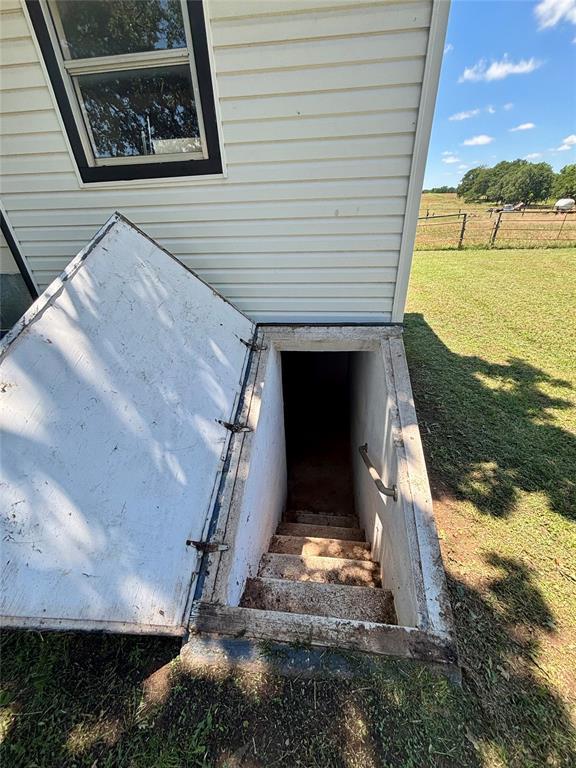 5311 S Cason Rd, Marlow, OK 73055 - entry to storm shelter with a yard