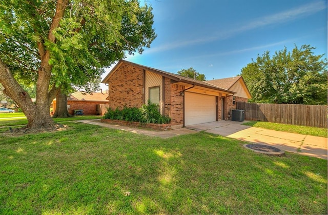 1405 Creston Way, Edmond, OK 73012 - view of front of home with brick siding, driveway, and a garage