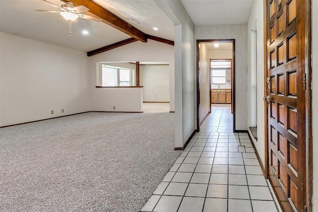 1405 Creston Way, Edmond, OK 73012 - corridor with plenty of natural light, light colored carpet, and light tile patterned flooring