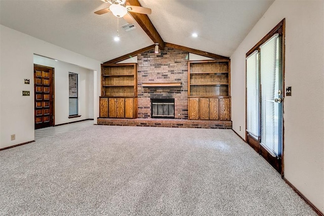 1405 Creston Way, Edmond, OK 73012 - unfurnished living room featuring carpet, built in features, a ceiling fan, and healthy amount of natural light