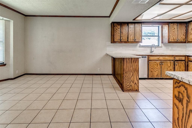 1405 Creston Way, Edmond, OK 73012 - kitchen featuring brown cabinets, light countertops, dishwasher, tasteful backsplash, and crown molding