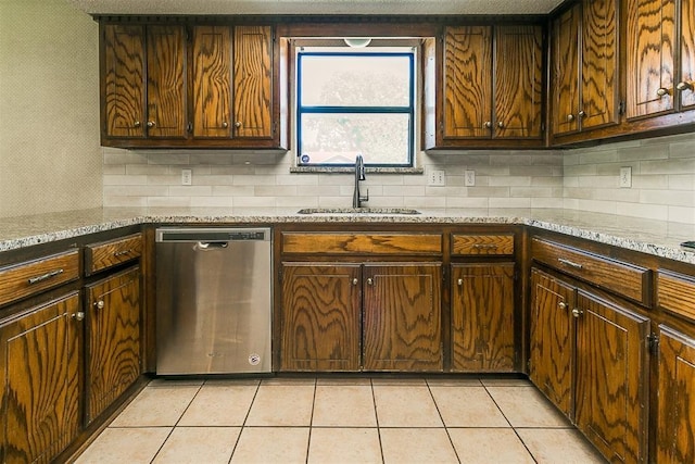 1405 Creston Way, Edmond, OK 73012 - kitchen with dishwasher, tasteful backsplash, light tile patterned flooring, and light stone countertops