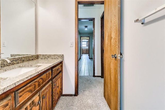 1405 Creston Way, Edmond, OK 73012 - bathroom with vanity and baseboards