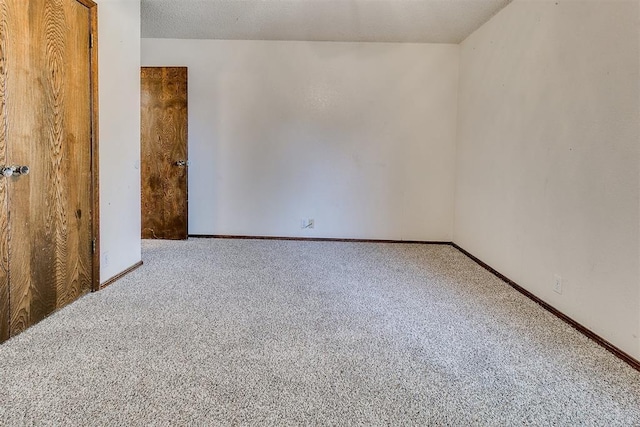 1405 Creston Way, Edmond, OK 73012 - carpeted empty room with baseboards