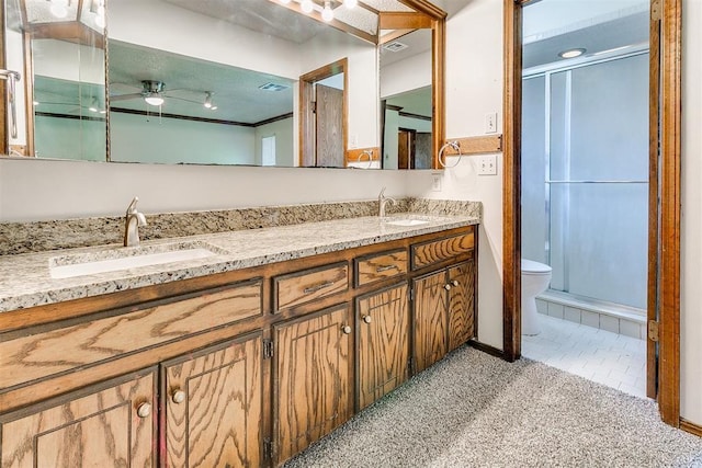 1405 Creston Way, Edmond, OK 73012 - full bath with double vanity, a ceiling fan, and a stall shower