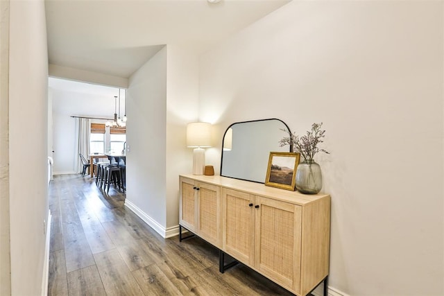 16336 Coldfire Rd, Oklahoma City, OK 73170 - hall featuring a chandelier and dark wood-type flooring