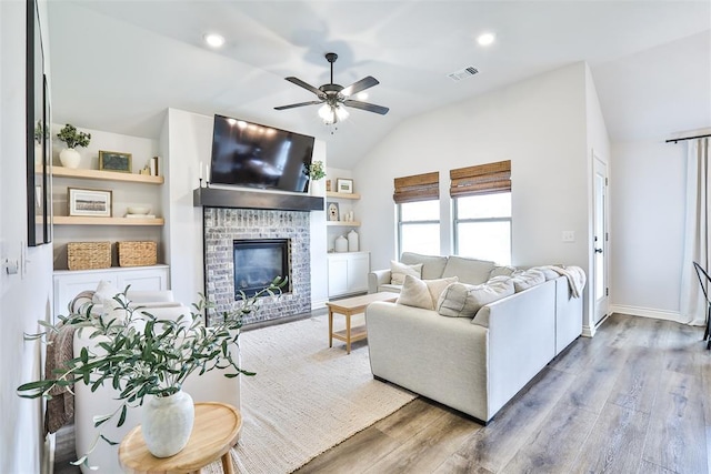 16336 Coldfire Rd, Oklahoma City, OK 73170 - living room featuring lofted ceiling, ceiling fan, wood finished floors, a fireplace, and recessed lighting