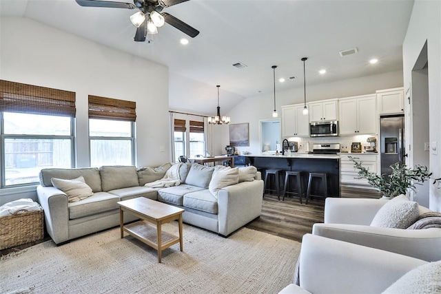 16336 Coldfire Rd, Oklahoma City, OK 73170 - living room with lofted ceiling, a chandelier, a ceiling fan, light wood finished floors, and recessed lighting