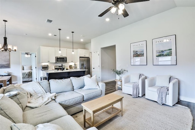 16336 Coldfire Rd, Oklahoma City, OK 73170 - living area featuring ceiling fan, light wood-type flooring, recessed lighting, and a chandelier
