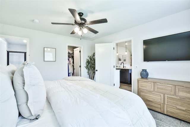 16336 Coldfire Rd, Oklahoma City, OK 73170 - bedroom with a walk in closet, ensuite bathroom, and a ceiling fan