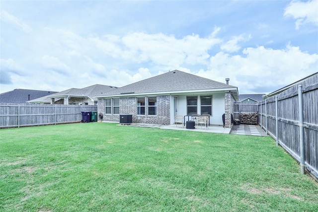 16336 Coldfire Rd, Oklahoma City, OK 73170 - rear view of house with a fenced backyard, a patio, roof with shingles, and brick siding