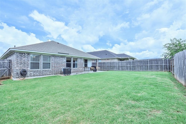 16336 Coldfire Rd, Oklahoma City, OK 73170 - back of property featuring brick siding, a fenced backyard, a patio area, and roof with shingles