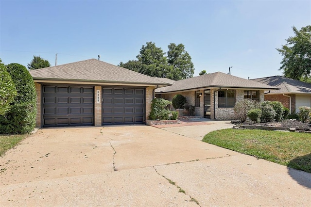 2617 NW 58th St, Oklahoma City, OK 73112 - ranch-style house featuring driveway, brick siding, covered porch, and a garage