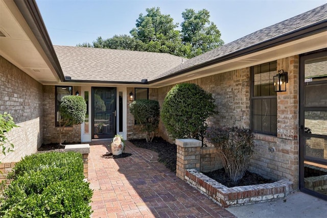2617 NW 58th St, Oklahoma City, OK 73112 - entrance to property with a shingled roof and brick siding