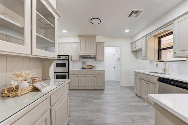 2617 NW 58th St, Oklahoma City, OK 73112 - kitchen with double wall oven, dishwasher, tasteful backsplash, recessed lighting, and gas cooktop