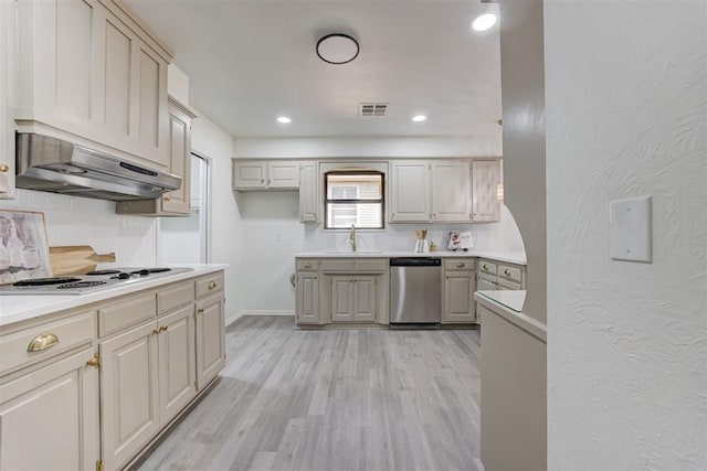 2617 NW 58th St, Oklahoma City, OK 73112 - kitchen with stainless steel dishwasher, white electric stovetop, exhaust hood, backsplash, and recessed lighting