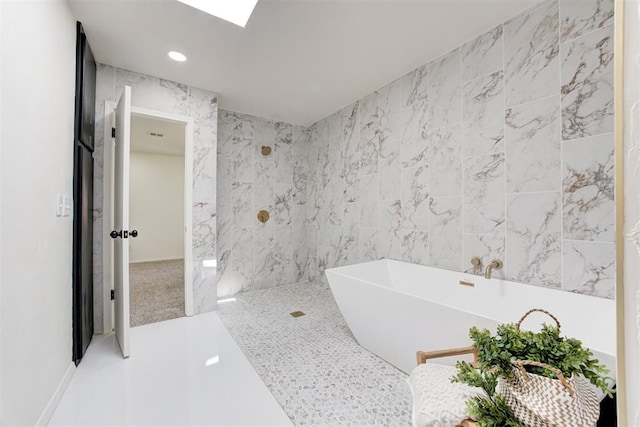 2617 NW 58th St, Oklahoma City, OK 73112 - bathroom with a freestanding bath, tile walls, and recessed lighting
