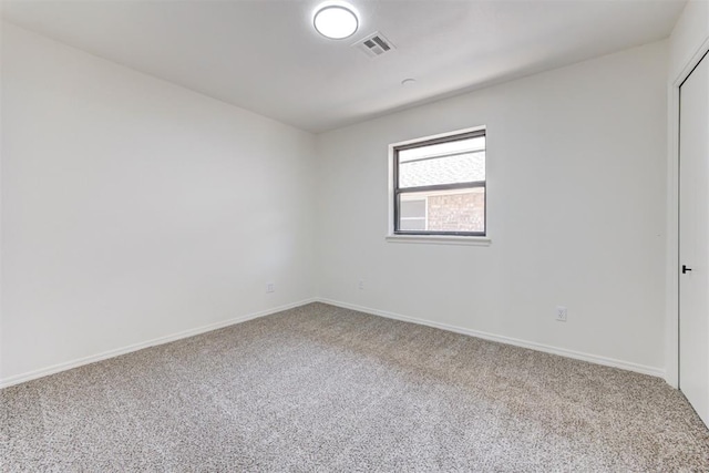 2617 NW 58th St, Oklahoma City, OK 73112 - spare room featuring carpet and baseboards