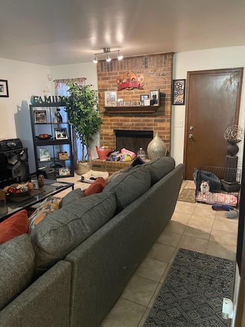 10625 White Oak Canyon Rd, Oklahoma City, OK 73162 - tiled living room featuring a brick fireplace