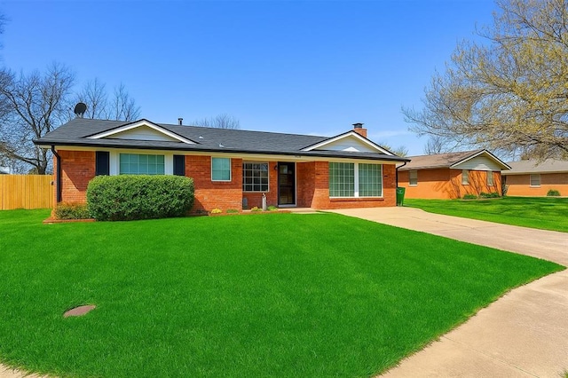 302 Tanglewood Dr, Yukon, OK 73099 - single story home with brick siding, a chimney, concrete driveway, and a shingled roof